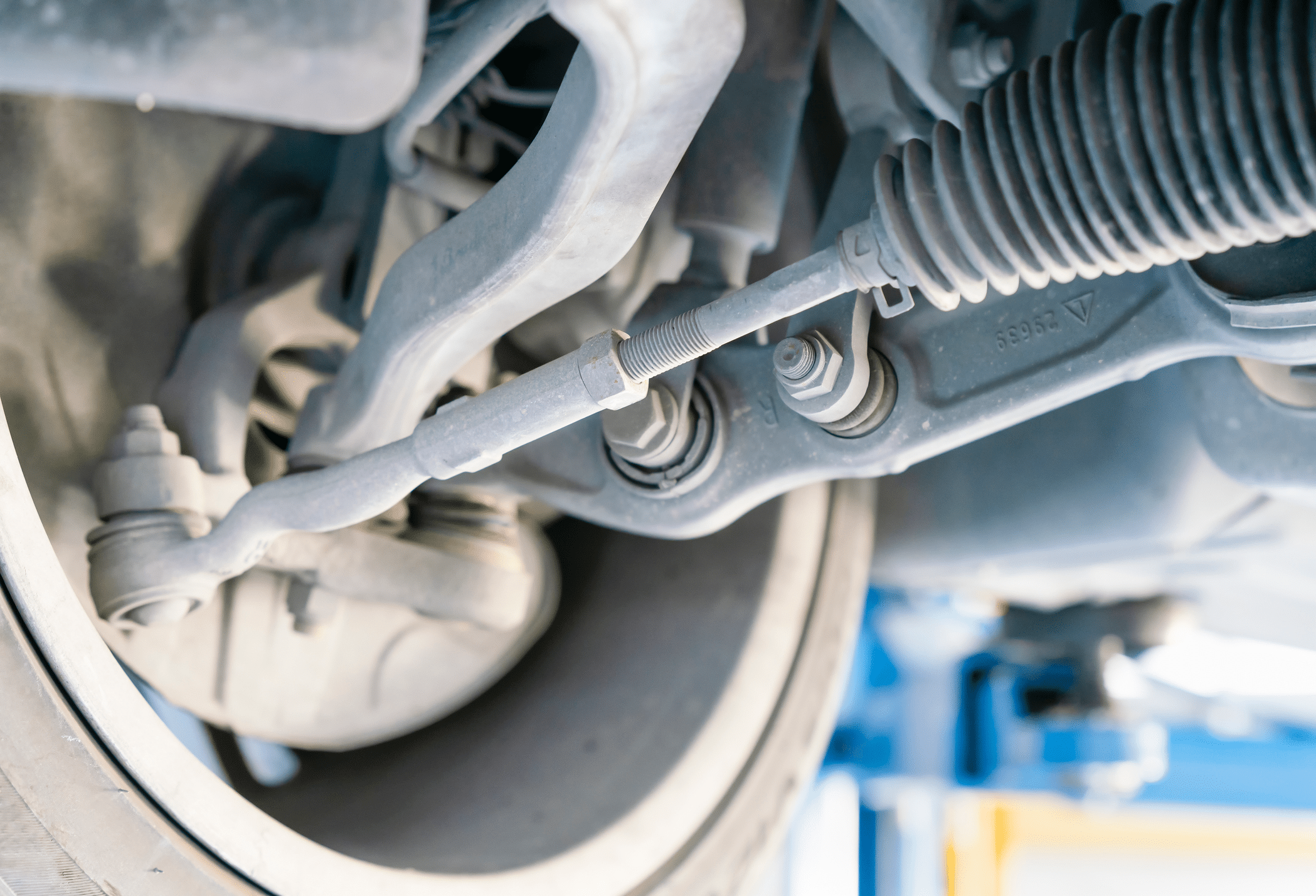 A person checking power steering fluid levels